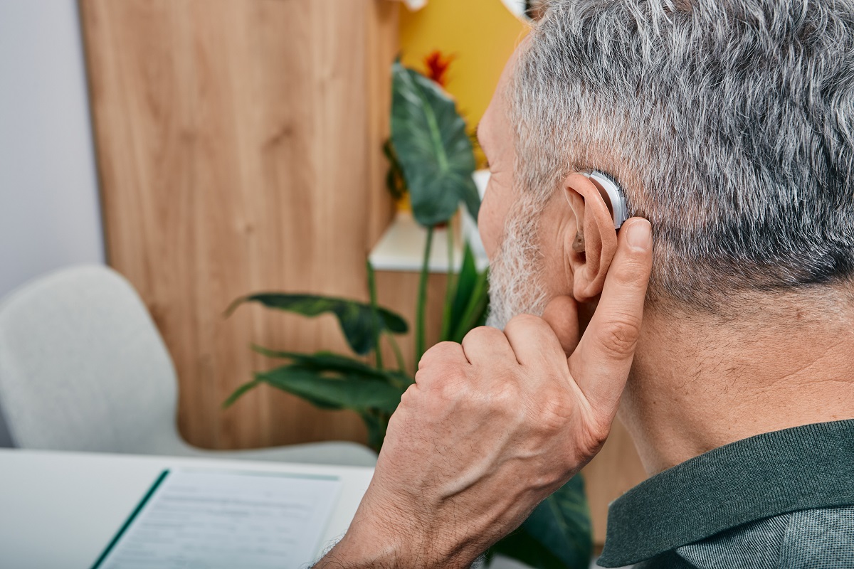 Hearing Solutions For Elderly Deafness People. Older Gray-haired