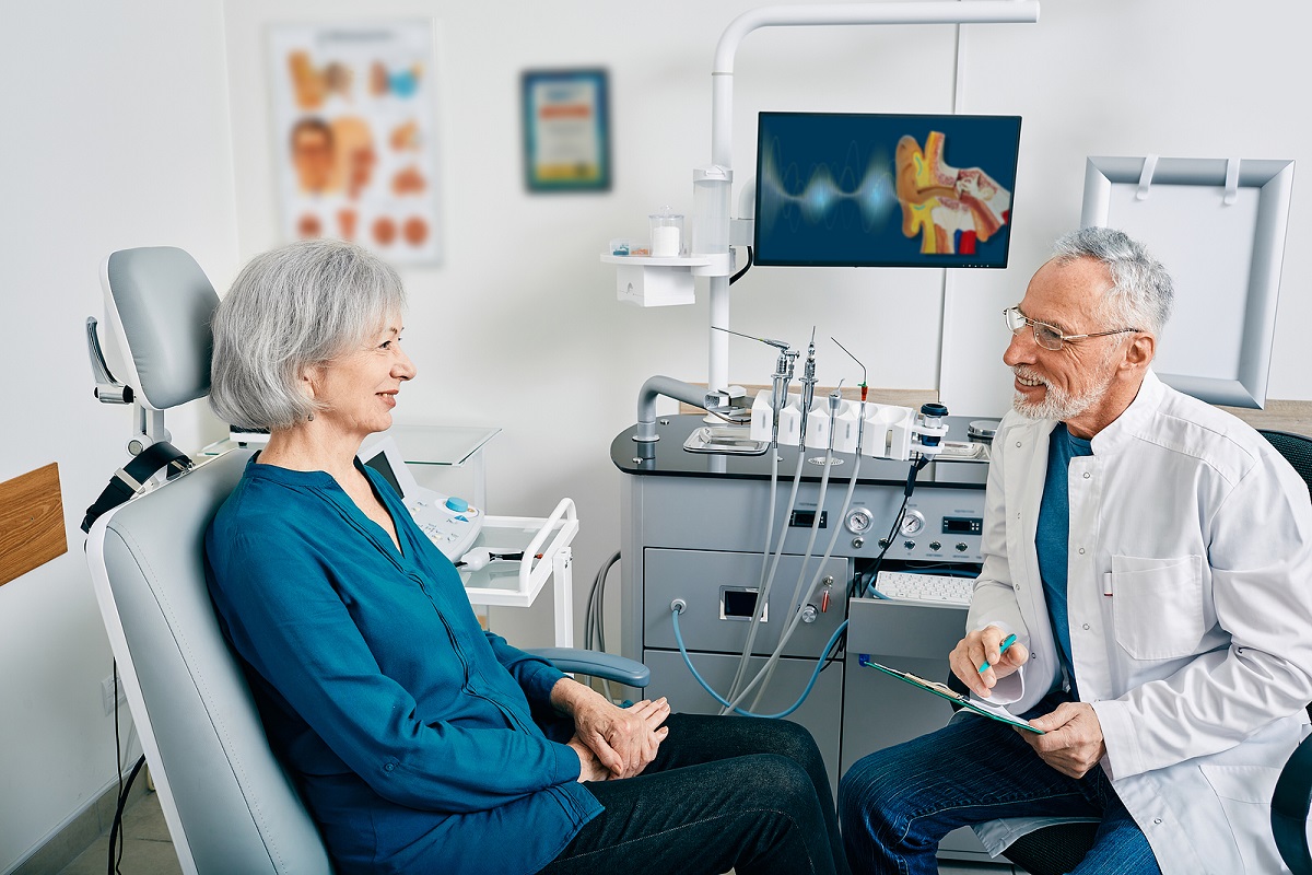 Senior Woman While Consultation With Ent Doctor At Medical Clini